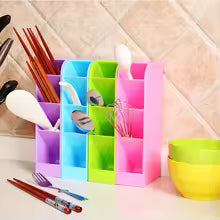 Colorful desktop storage case by Clarify.pk organizing utensils and stationery on kitchen counter