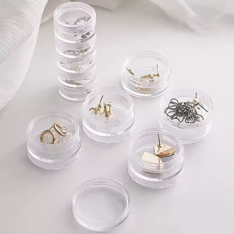 Clear 5 layer jewelry storage box by Clarify.pk with separate compartments storing rings earrings and chains
