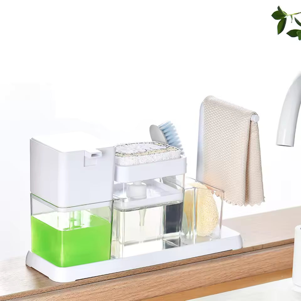 Clarify.pk dish soap dispenser caddy with green soap, sponge holder, brush, and towel on kitchen counter