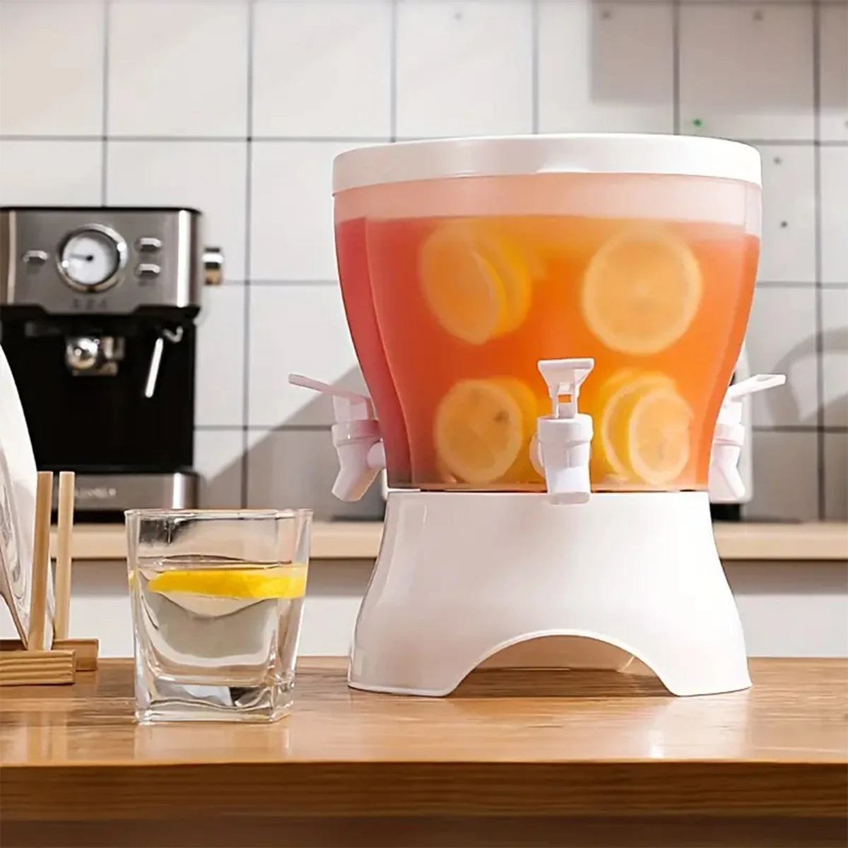 Clarify.pk beverage dispenser with divider design beverage container filled with citrus drink and lemon slices on white stand