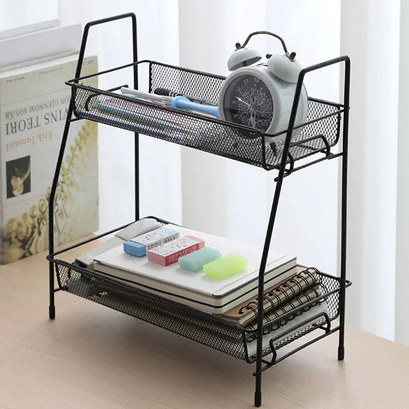 Black metal double layer kitchen storage rack holding books, stationery, and a clock on a wooden table