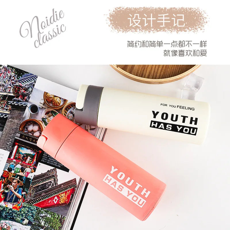 Stylish double layer plastic glass cup in pink and beige design with motivational text