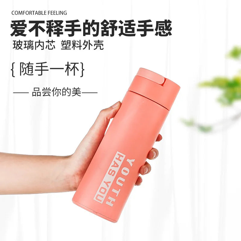 Stylish double layer plastic glass cup in coral pink, perfect for hot and cold beverages