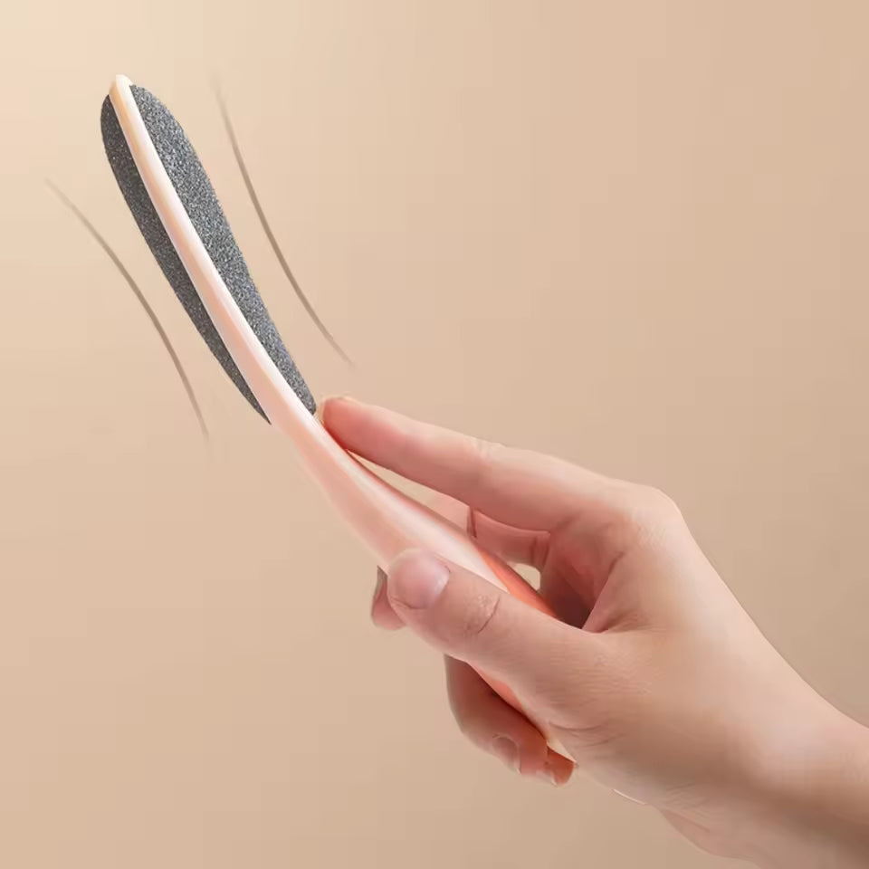 Hand holding Clarify.pk double sided foot file for callus removal with ergonomic pink handle