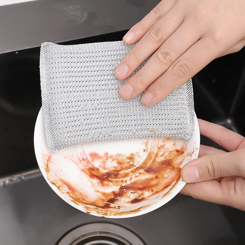 Clarify.pk double sided kitchen cleaning sponge pack of 4 scrubbing a dirty plate in sink
