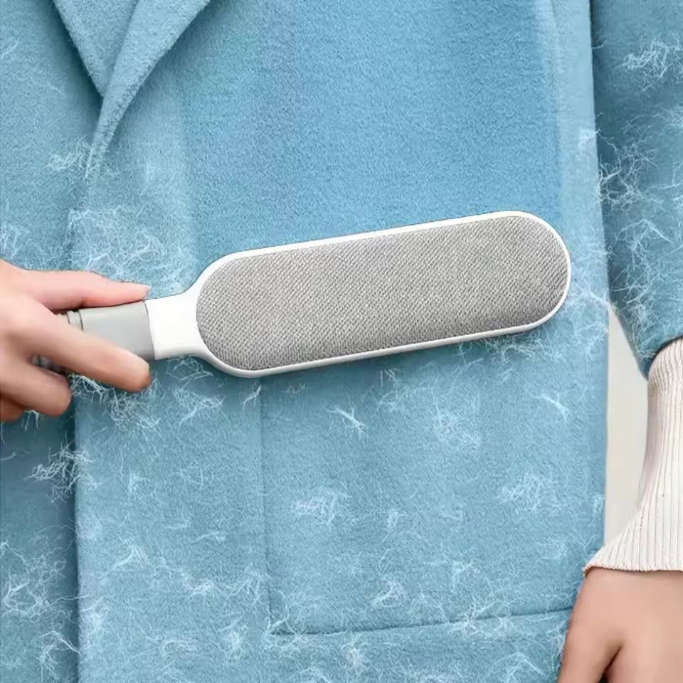 Clarify.pk double sided pet hair remover brush cleaning pet hair from blue fabric coat