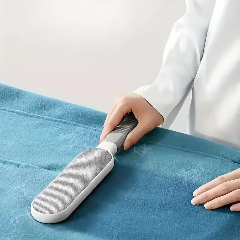 Clarify.pk double sided pet hair remover brush cleaning white pet hair from blue fabric
