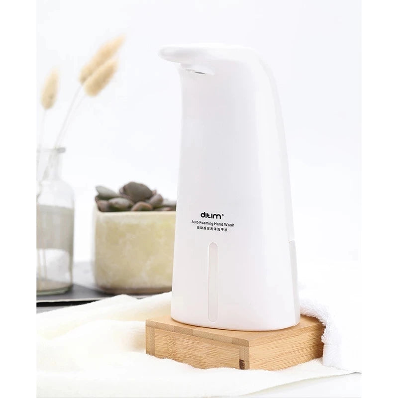 Clarify.pk white automatic foam soap dispenser on wooden base for portable use
