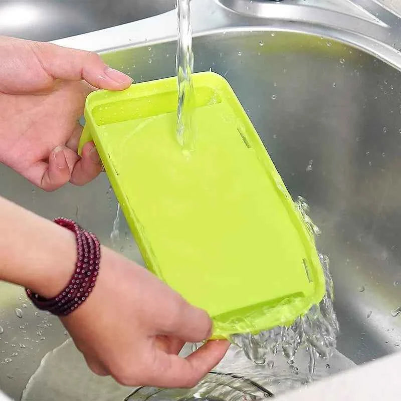 Hand washing a vibrant green durable kitchen knife holder by the sink for easy cleaning and maintenance