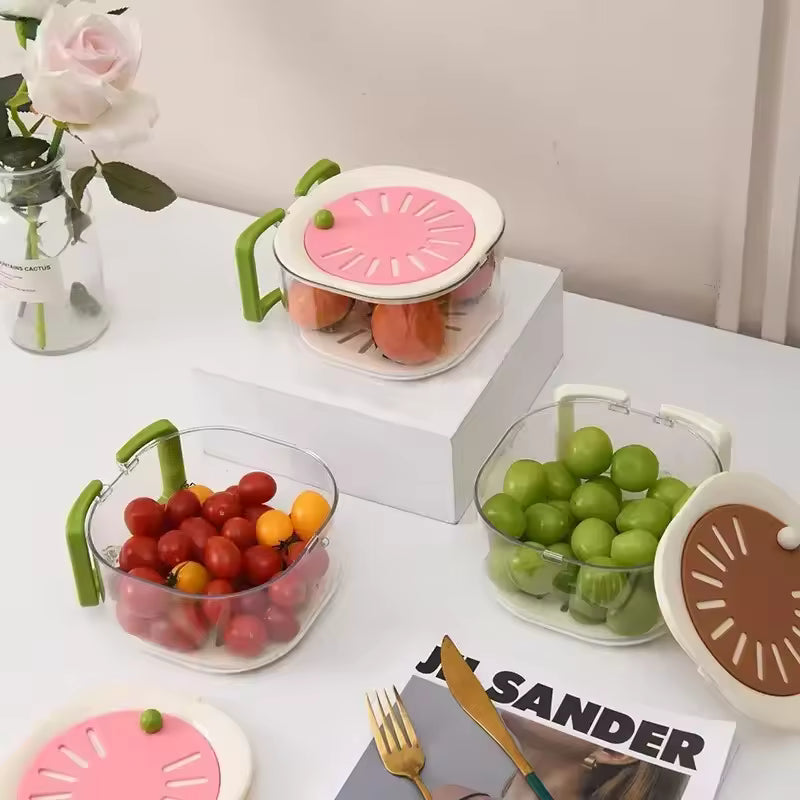 Transparent dust-proof fruit drainer basket with green handles and colorful lids holding various fruits