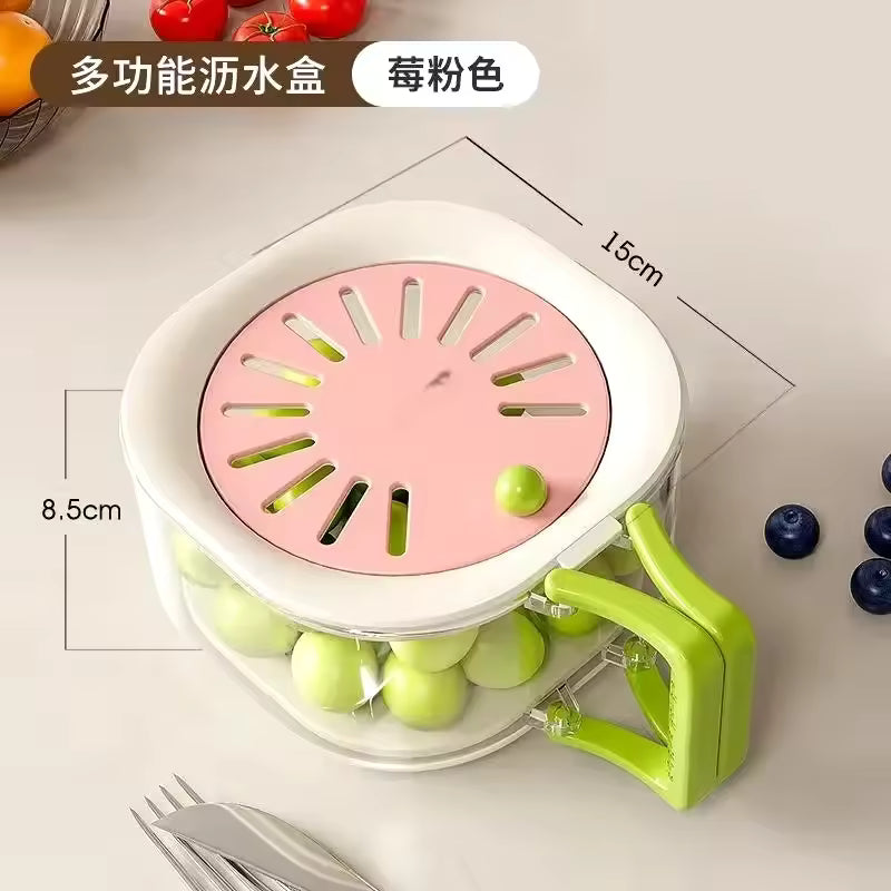 Dust-proof fruit drainer basket with pink lid and green handle for kitchen use holding green grapes