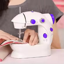 Compact electric sewing machine with light in white and purple for precise stitching by Clarify.pk