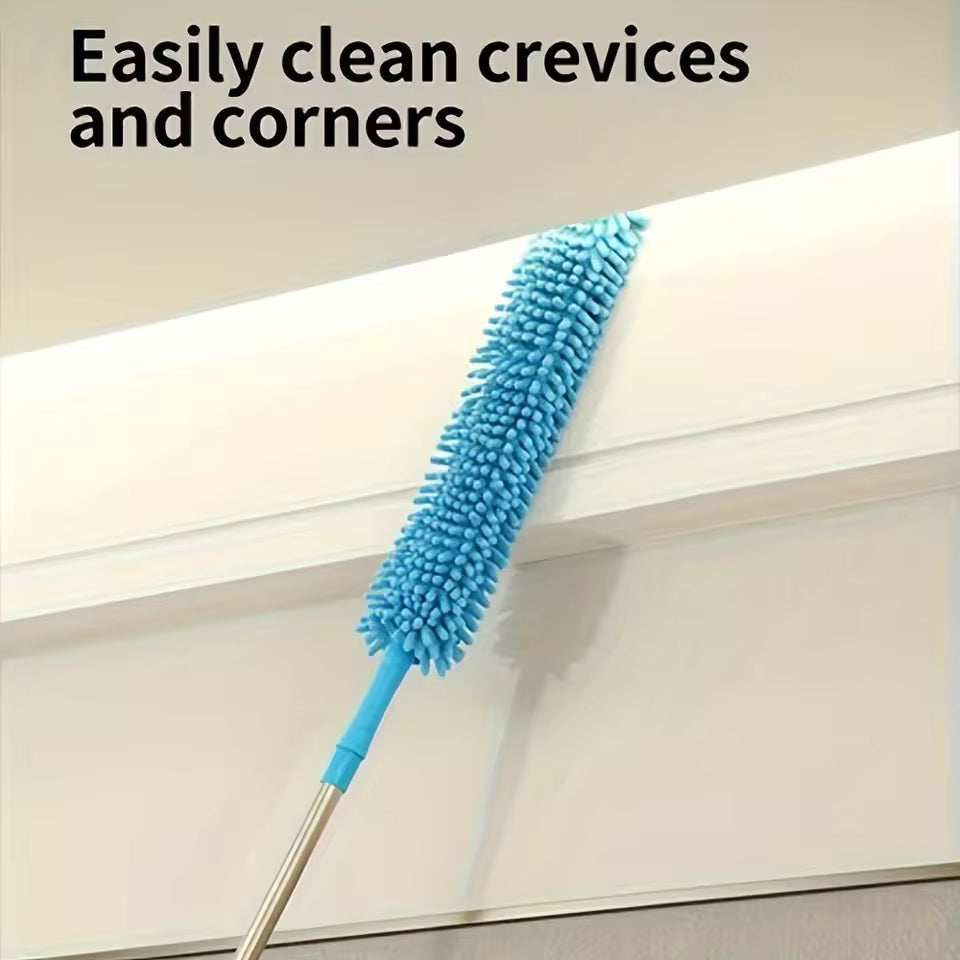 Blue extendable dust removal brush cleaning crevices and corners on a ceiling edge