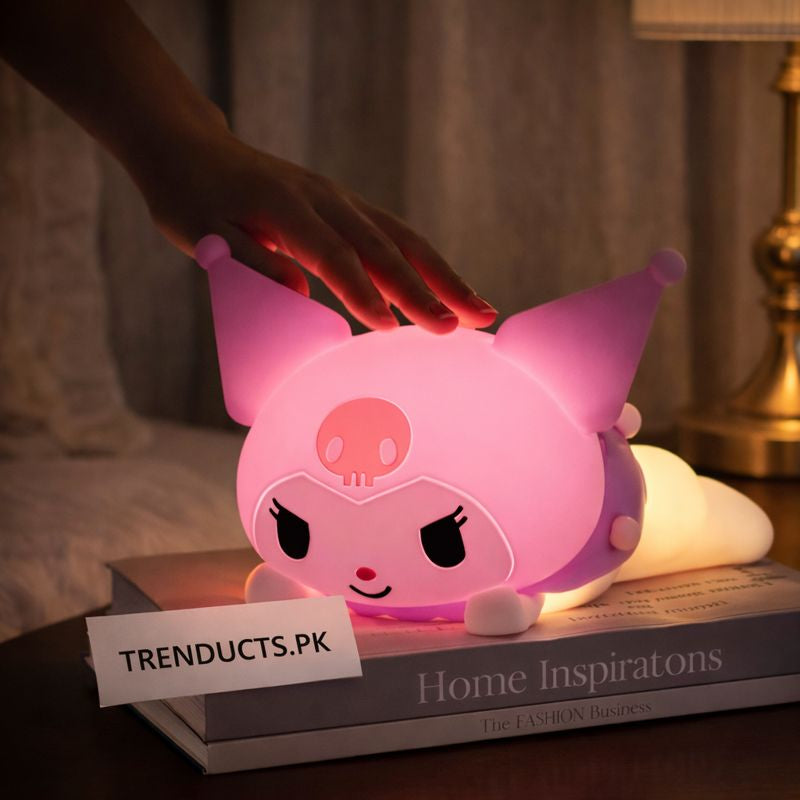 Pink Kuromi lying posture silicone night light glowing on a bed with touch sensor demonstration.