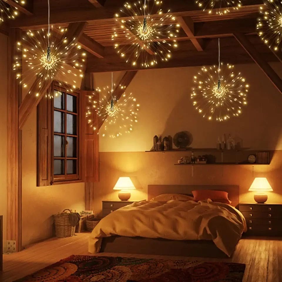 Firework string lights battery operated hanging from wooden ceiling in cozy bedroom with warm lighting