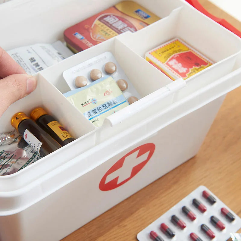 Clarify.pk white first aid kit storage box with organized compartments holding medicine and medical supplies