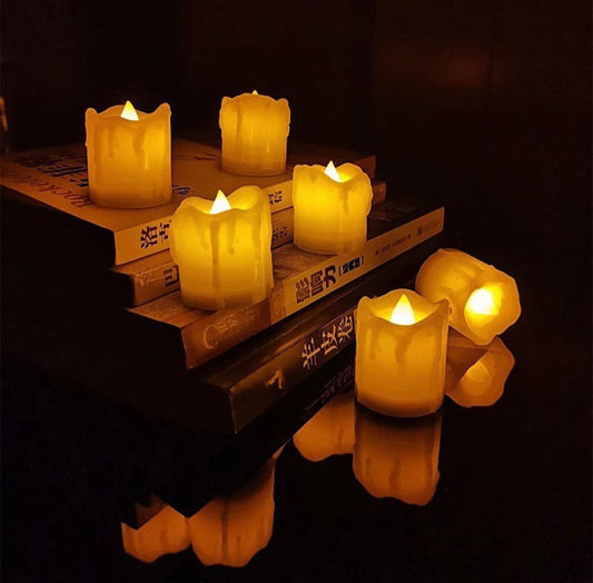 Clarify.pk flameless LED tea lights set with realistic flickering flame effect on stacked books