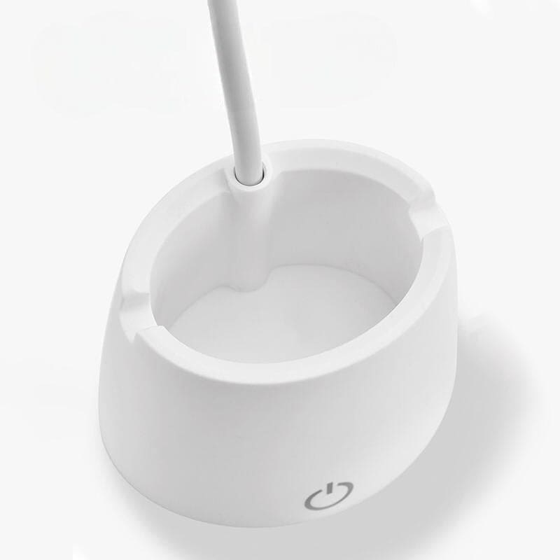 White base of flexible smart LED desk lamp with power button and adjustable neck by Clarify.pk