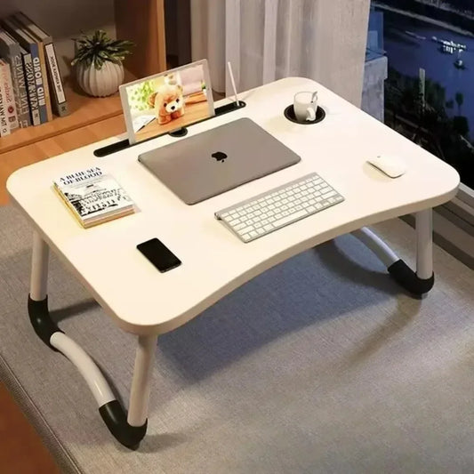 Clarify.pk foldable laptop desk in white with adjustable legs holding laptop keyboard mouse and phone