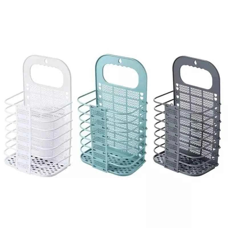 Set of three foldable laundry basket in white, teal, and gray with perforated design and handles