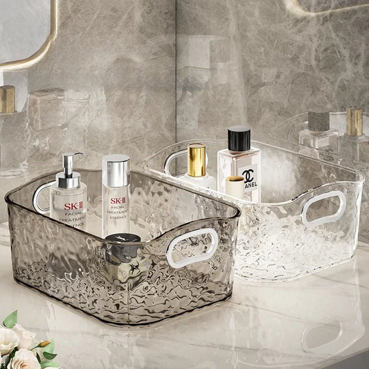 Clarify.pk foldable laundry hamper storage baskets in clear and smoky designs holding skincare bottles