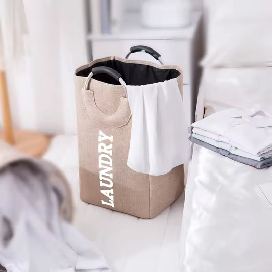 Clarify.pk foldable laundry hamper with handles in beige fabric with white laundry text and black interior