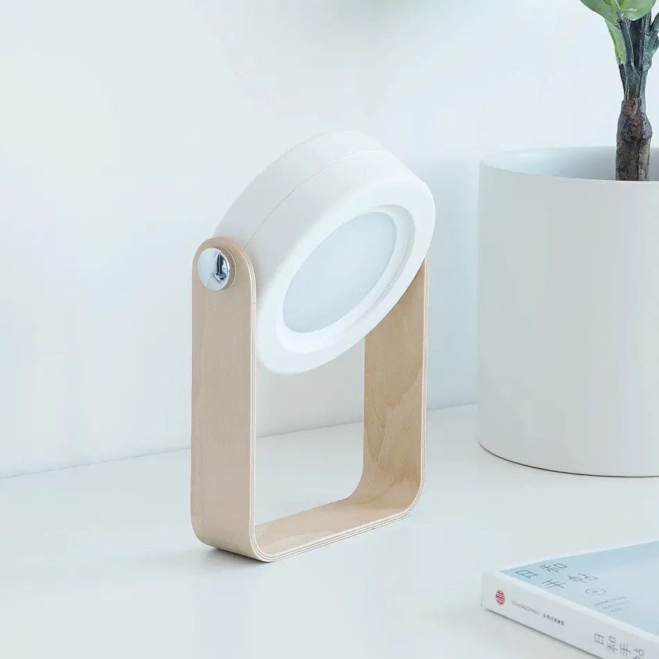 Clarify.pk foldable LED table lamp with wooden base and adjustable white light head on desk