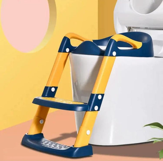 Yellow and blue foldable step stool for kids attached to a white toilet for easy bathroom access