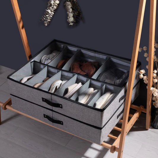 Gray foldable under bed shoe organizer with multiple compartments storing various shoes neatly