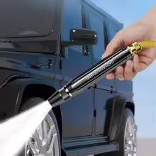 Clarify.pk high pressure wash gun spraying water on black SUV tire for cleaning