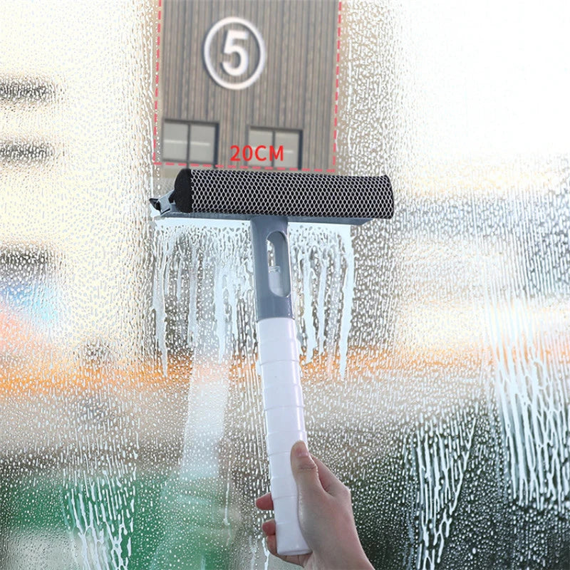 3 in 1 glass cleaning tool with white handle cleaning a wet glass window effectively