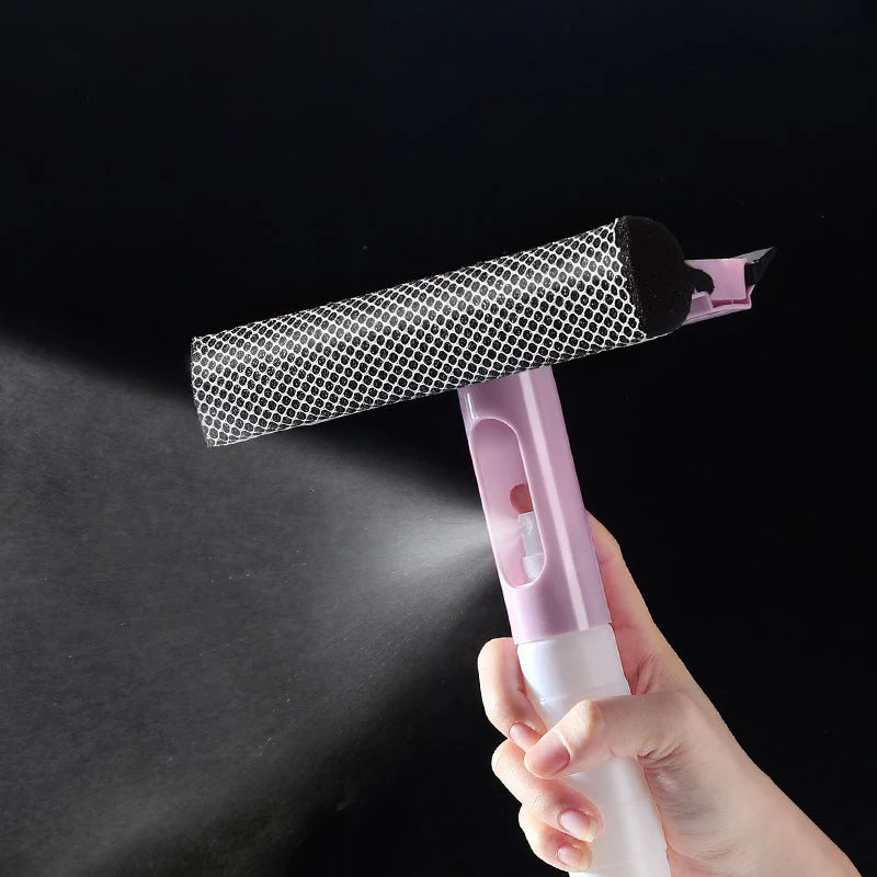 Clarify.pk 3 in 1 glass cleaning tool with spray bottle and black sponge head held in hand