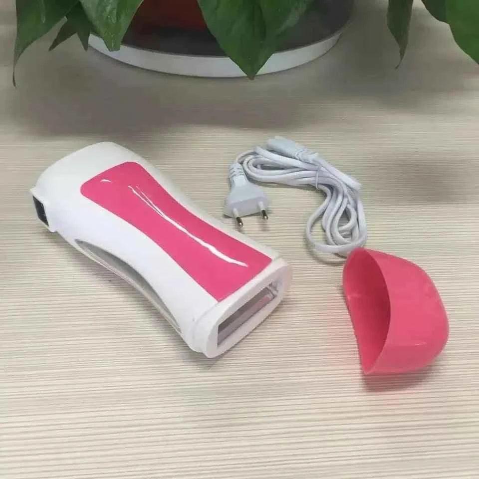 Clarify 3 in 1 wax heater with white and pink design, power cord, and detachable cap on a wooden surface
