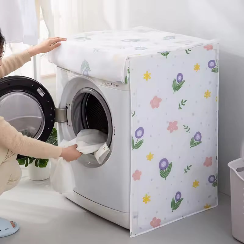 Floral patterned drum washing machine cover protecting white washing machine in a bright laundry room
