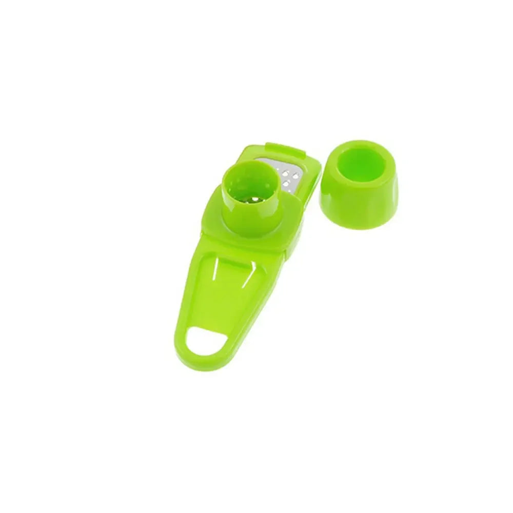 Green ginger garlic crusher tool for easy crushing of garlic and ginger