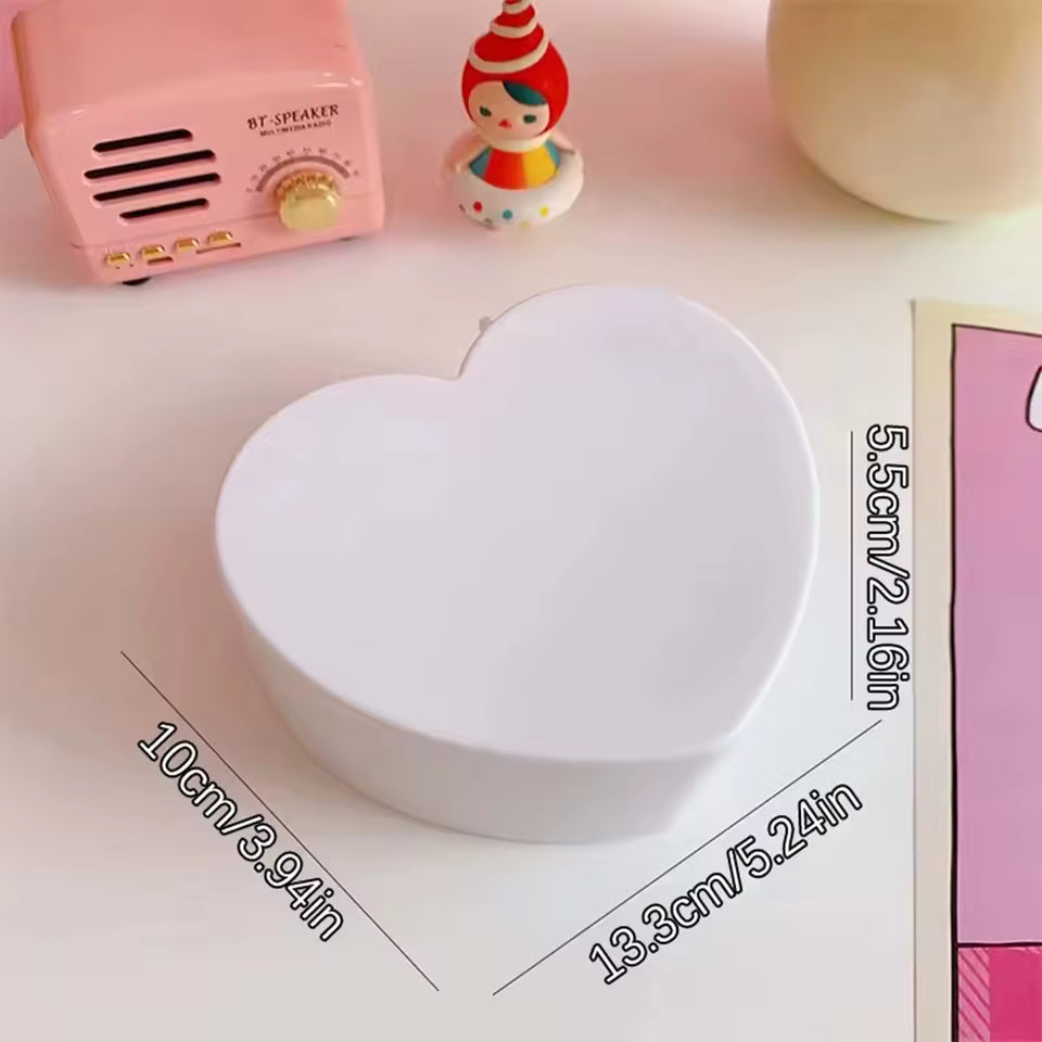 White heart shaped jewelry storage box by Clarify.pk with compact dimensions on a desk