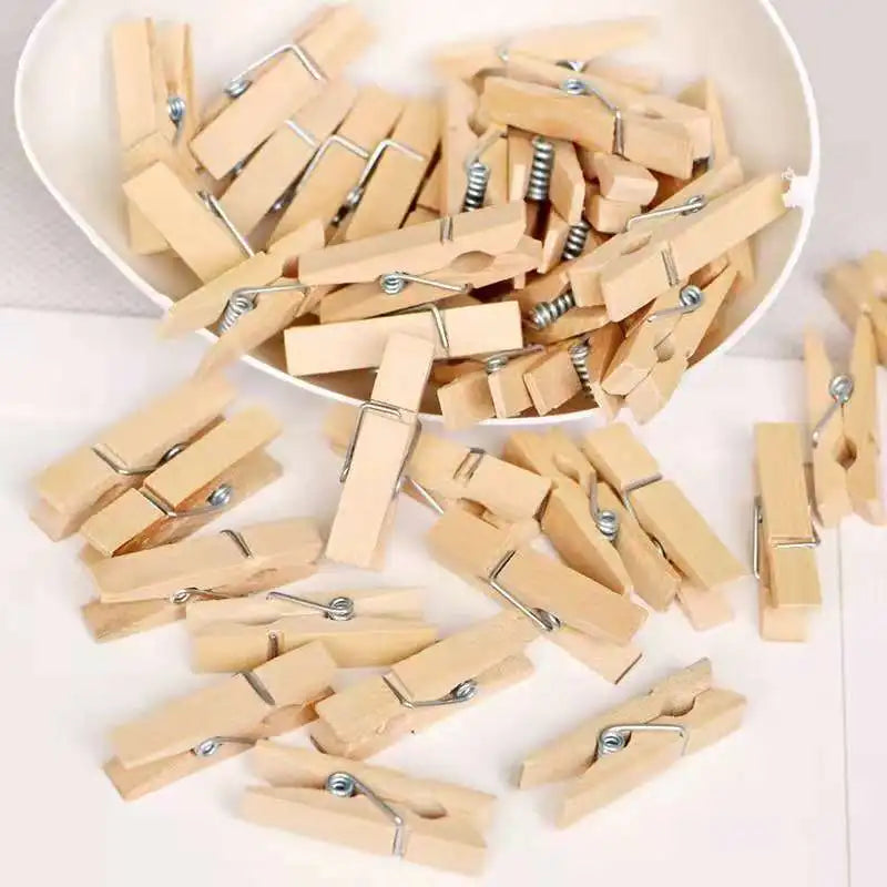 Clarify.pk mini wooden craft clips scattered and in a white heart-shaped container