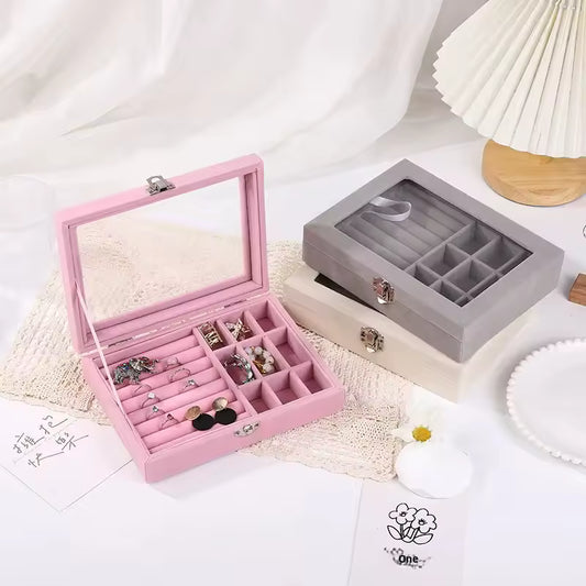 Pearl earring and ring organizer cosmetic case in pink and gray with multiple compartments and transparent lid