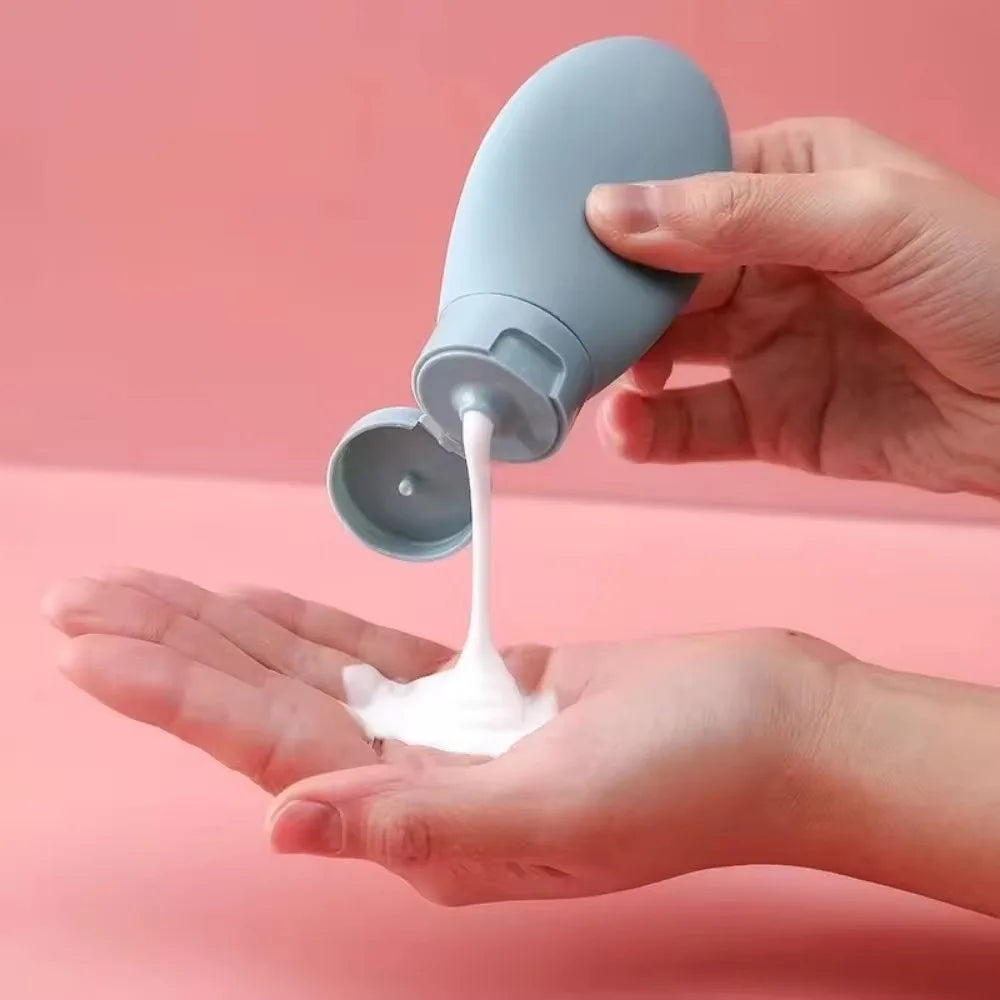 Refillable portable lotion container 3 pack by Clarify.pk shown dispensing lotion onto hand