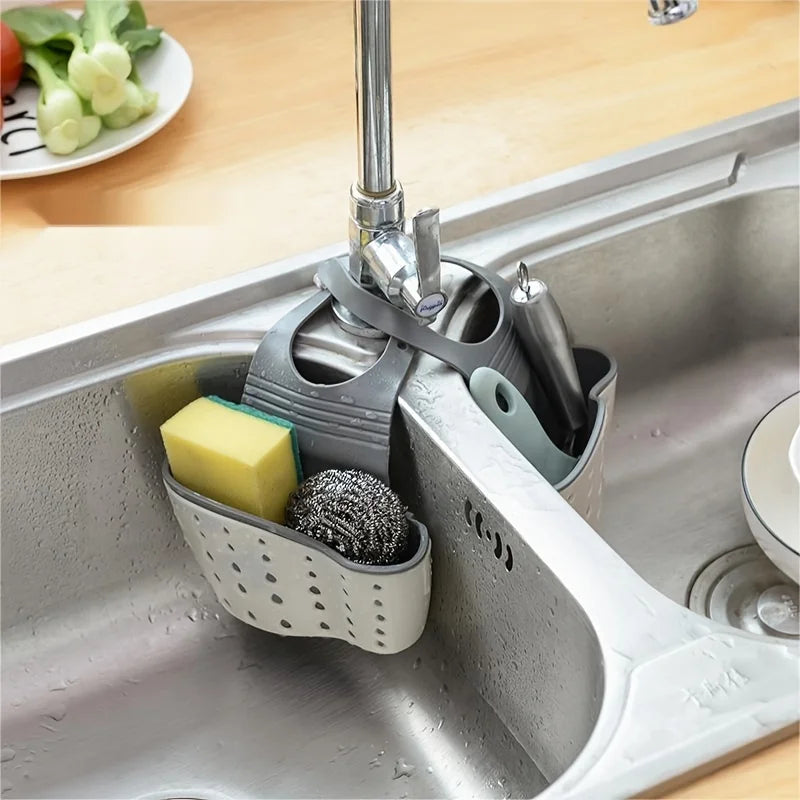 Clarify.pk sink hanging storage organizer attached to kitchen sink holding sponges and scrubbers