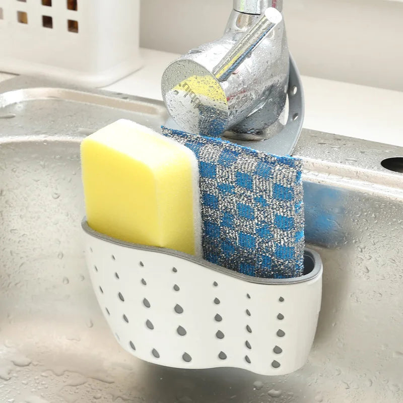 Clarify.pk sink hanging storage organizer holding sponge and scrubber attached to kitchen faucet