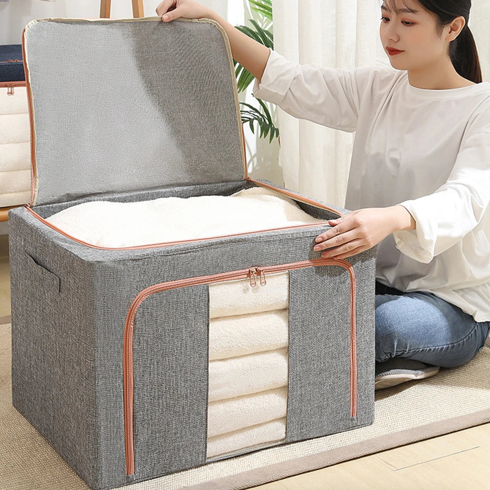 Clarify.pk stackable storage bag for clothes in gray fabric with zipper and handle being opened by woman
