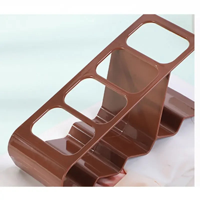 Brown plastic TV remote stand holder with multiple slots for organizing remotes