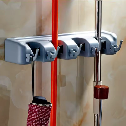 Clarify.pk gray wall mounted mop holder with multiple slots holding brooms and mops