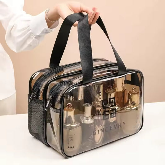 Clear waterproof toiletries cosmetics organizer bag by Clarify pk with black handles and multiple compartments