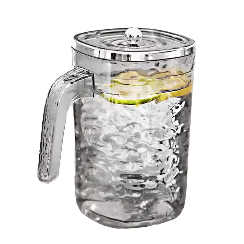 Clarify.pk glass juice pitcher with lid featuring textured design and handle filled with lemon water