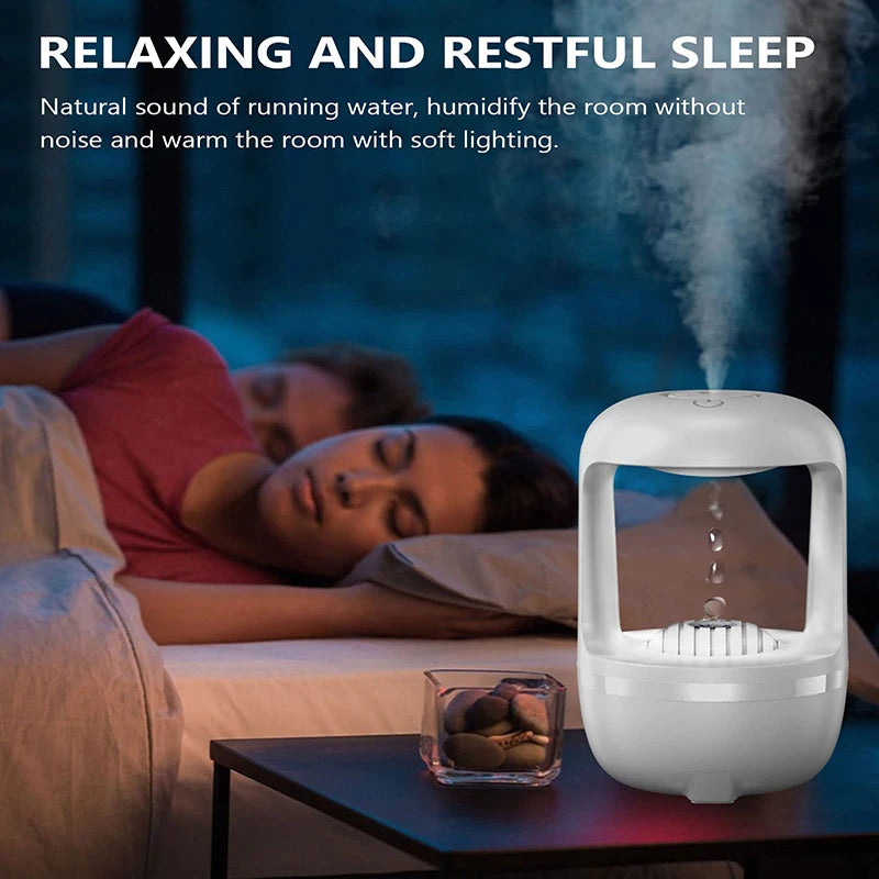 Glow in the dark air humidifier releasing mist beside sleeping couple for restful sleep