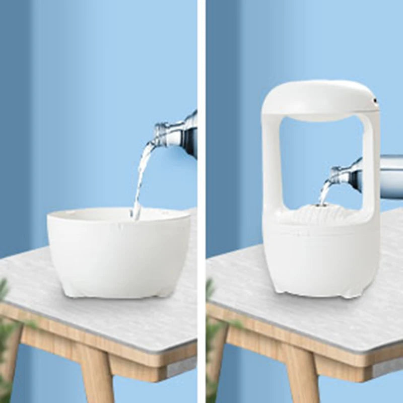 Clarify.pk glow in the dark air humidifier white modern design pouring water on wooden table