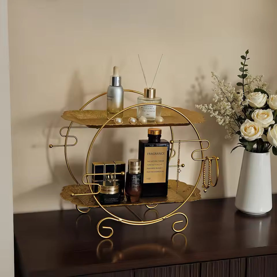 Clarify.pk 2 tier bathroom organizer in gold with circular design holding skincare and perfume bottles