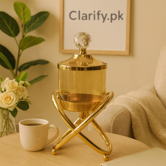 Elegant gold crystal jar for home decor with a faceted lid on a stylish gold stand